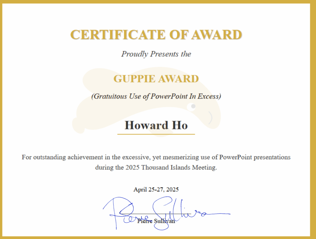 Howard Ho receiving the GUPPIE award for outstanding PowerPoint presentation